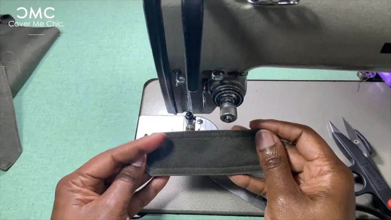 Sewing and topstitching the shoulder tabs with marked buttonholes