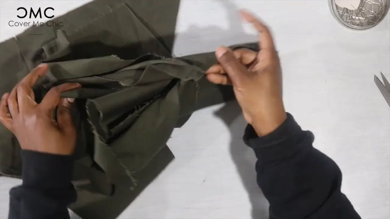 Sandwiching front and back yolks together and sewing shoulder seams